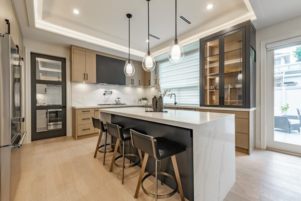 Modern custom kitchen with deep drawers, layered lighting, and reachable storage for aging-in-place comfort