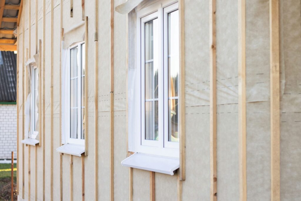 Building envelope insulation and triple-pane window detail in a BC custom home affecting quote pricing