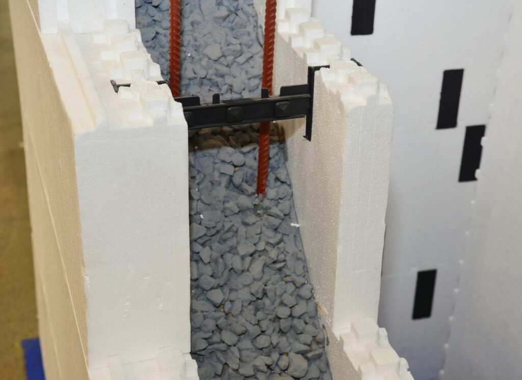 ICF foundation wall assembly showing foam insulation on both sides of a reinforced concrete core