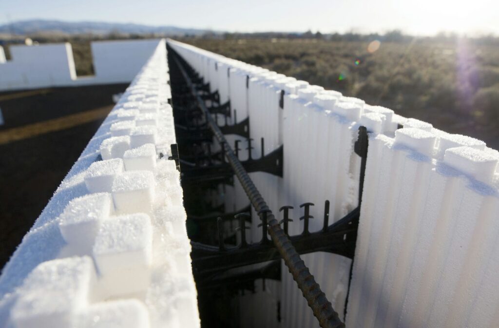 An ICF foundation being built for a custom home, with foam forms and rebar before the concrete pour