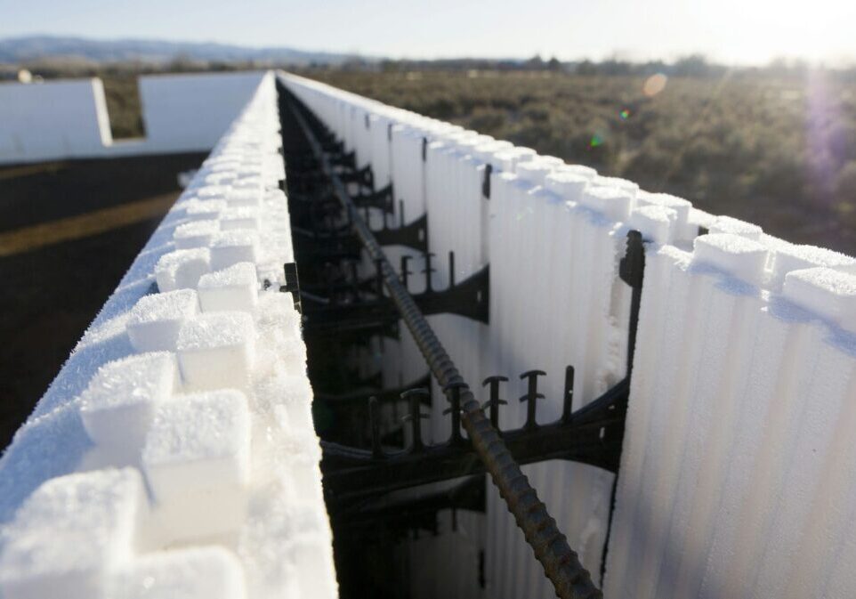 An ICF foundation being built for a custom home, with foam forms and rebar before the concrete pour